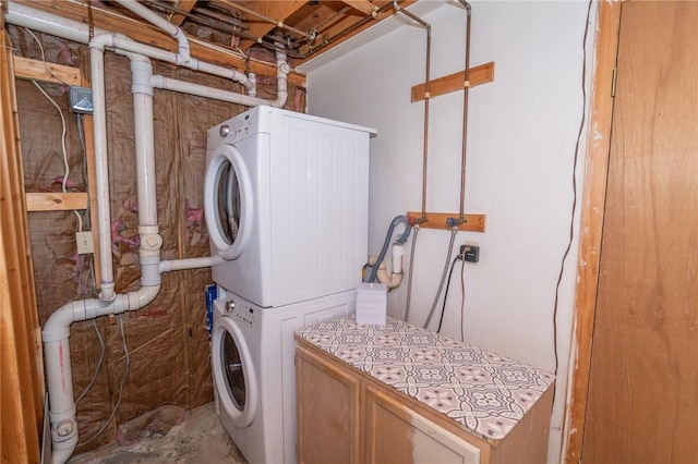 36 Wadsworth St, Warwick, RI 02889 - washroom with stacked washer / dryer and cabinet space