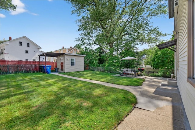 270 Central St, Central Falls, RI 02863 - fenced backyard featuring an outbuilding and a patio