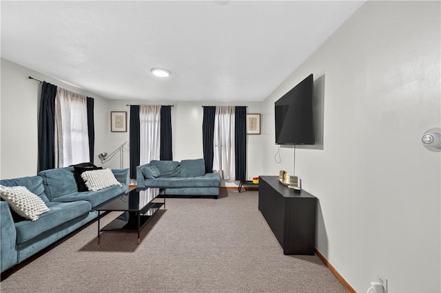 270 Central St, Central Falls, RI 02863 - carpeted living room featuring baseboards