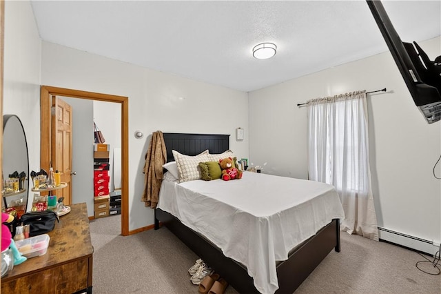 270 Central St, Central Falls, RI 02863 - carpeted bedroom featuring a baseboard heating unit