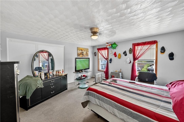 270 Central St, Central Falls, RI 02863 - carpeted bedroom featuring a textured ceiling and a ceiling fan
