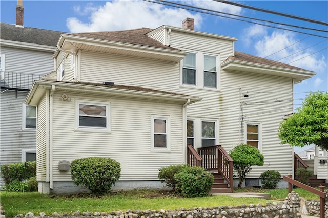 79 Winthrop St, Woonsocket, RI 02895 - rear view of house featuring a chimney