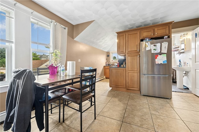 79 Winthrop St, Woonsocket, RI 02895 - dining room with baseboard heating, light tile patterned floors, and lofted ceiling