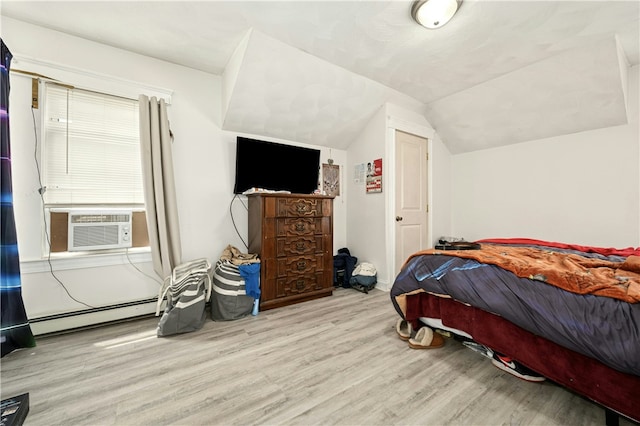 79 Winthrop St, Woonsocket, RI 02895 - bedroom featuring wood finished floors, a baseboard heating unit, lofted ceiling, and cooling unit