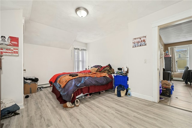 79 Winthrop St, Woonsocket, RI 02895 - bedroom featuring wood finished floors and a baseboard heating unit