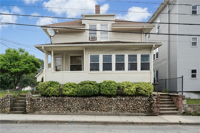 79 Winthrop St, Woonsocket, RI 02895 - american foursquare style home featuring stairs, a chimney, and roof with shingles