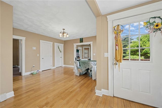 79 Winthrop St, Woonsocket, RI 02895 - entryway featuring a chandelier and light wood-style floors