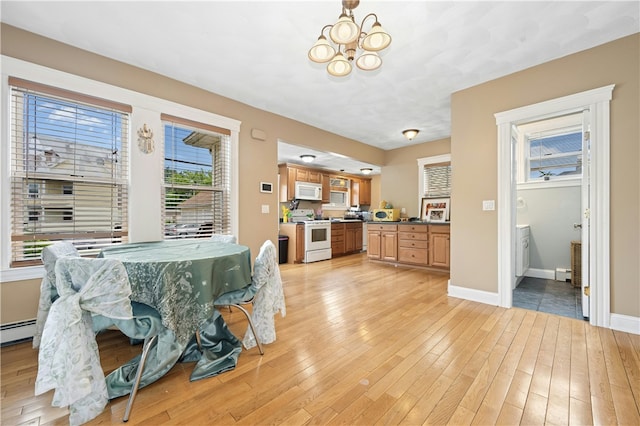 79 Winthrop St, Woonsocket, RI 02895 - dining area with light wood-style flooring and a chandelier