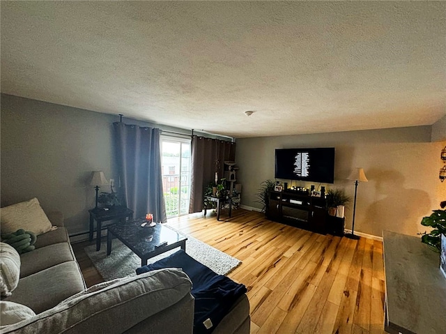 300 Smithfield Rd Unit B2-7, North Providence, RI 02904 - living area with wood finished floors and a textured ceiling