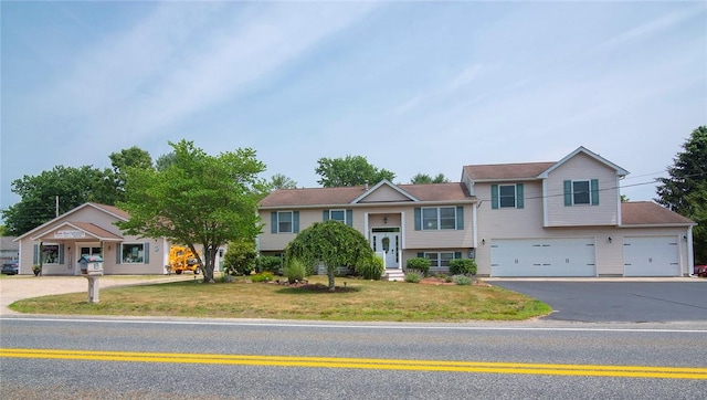 350 Narrow Ln, Charlestown, RI 02813 - view of front facade featuring asphalt driveway, a front yard, and an attached garage