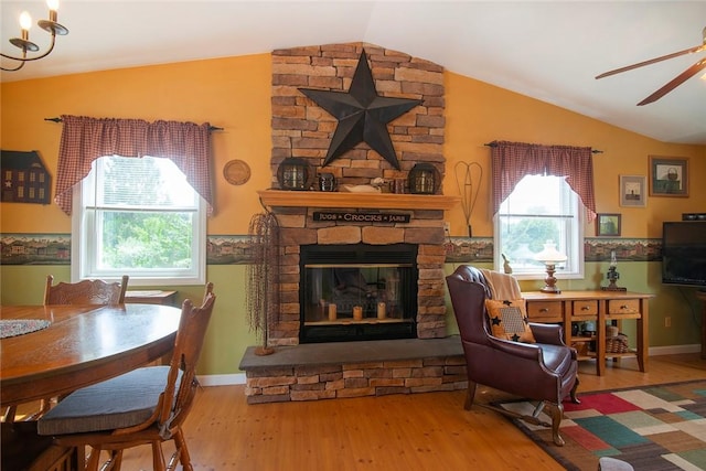 350 Narrow Ln, Charlestown, RI 02813 - living area featuring lofted ceiling, a stone fireplace, wood finished floors, healthy amount of natural light, and ceiling fan
