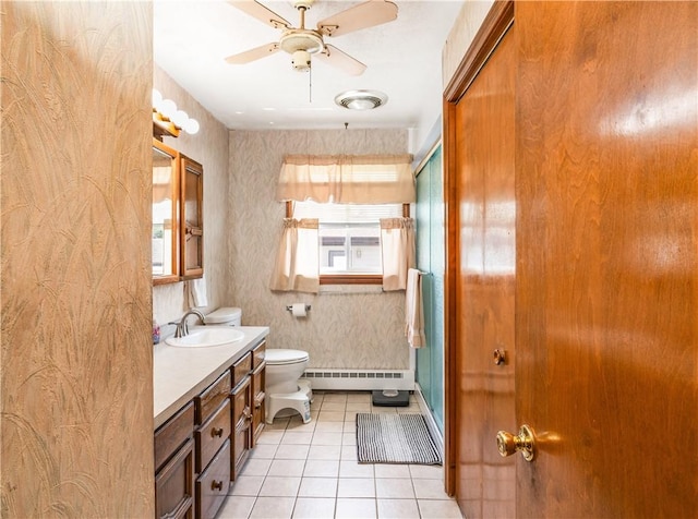 50 Tobey St, Providence, RI 02909 - bathroom featuring baseboard heating, tile patterned floors, vanity, and a ceiling fan