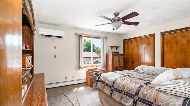 50 Tobey St, Providence, RI 02909 - carpeted bedroom featuring a baseboard heating unit, an AC wall unit, two closets, and ceiling fan