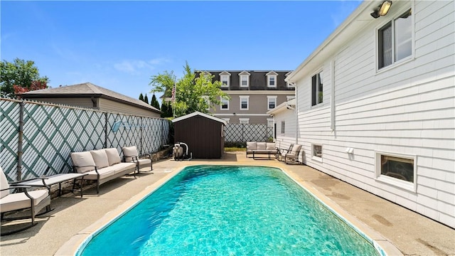 50 Tobey St, Providence, RI 02909 - view of pool featuring an outdoor living space, a patio area, a storage shed, and a fenced backyard