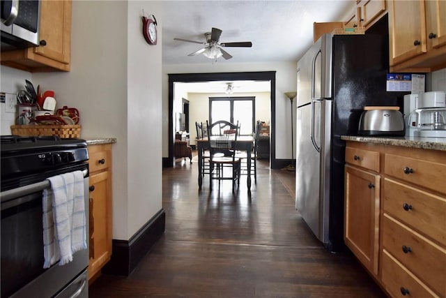 443 Harrington Ave, Warwick, RI 02888 - kitchen with appliances with stainless steel finishes, a ceiling fan, dark wood-type flooring, light stone counters, and brown cabinets