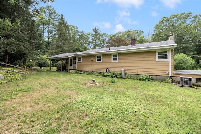 226 Westcott Rd, Scituate, RI 02857 - back of property featuring a chimney and a lawn
