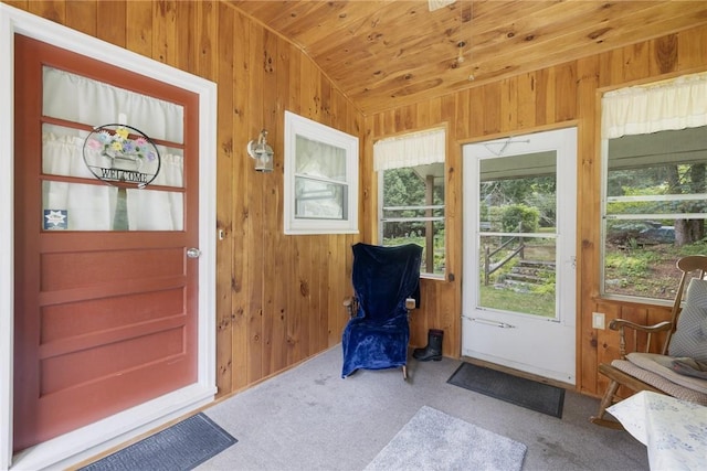 226 Westcott Rd, Scituate, RI 02857 - entryway with lofted ceiling, wooden walls, carpet flooring, and wooden ceiling