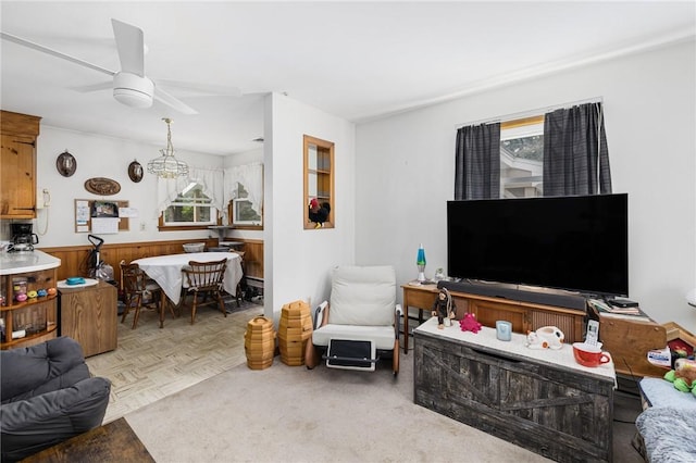 226 Westcott Rd, Scituate, RI 02857 - living room with healthy amount of natural light, ceiling fan, a wainscoted wall, and wooden walls