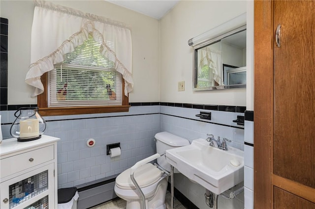 226 Westcott Rd, Scituate, RI 02857 - bathroom featuring tile walls, wainscoting, and a baseboard radiator