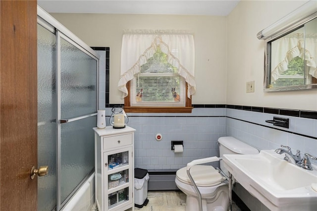 226 Westcott Rd, Scituate, RI 02857 - full bath with tile walls, a wainscoted wall, and shower / bath combination with glass door