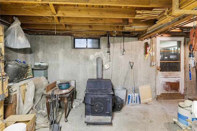 226 Westcott Rd, Scituate, RI 02857 - unfinished basement featuring a wood stove