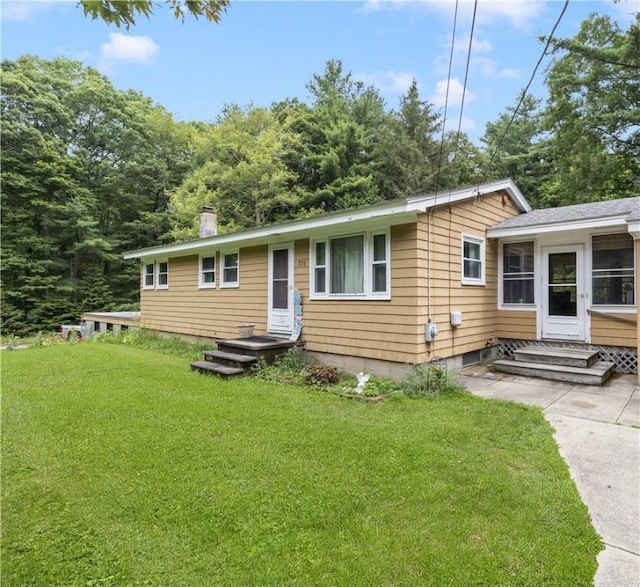226 Westcott Rd, Scituate, RI 02857 - view of front of home with a front yard, entry steps, and a chimney