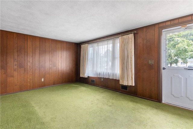 352 Cove Ave, Warwick, RI 02886 - spare room featuring wooden walls and carpet