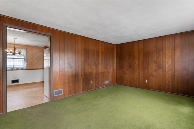 352 Cove Ave, Warwick, RI 02886 - spare room with a chandelier, carpet, and wood walls
