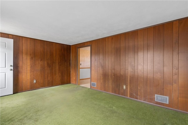 352 Cove Ave, Warwick, RI 02886 - spare room featuring wood walls and carpet