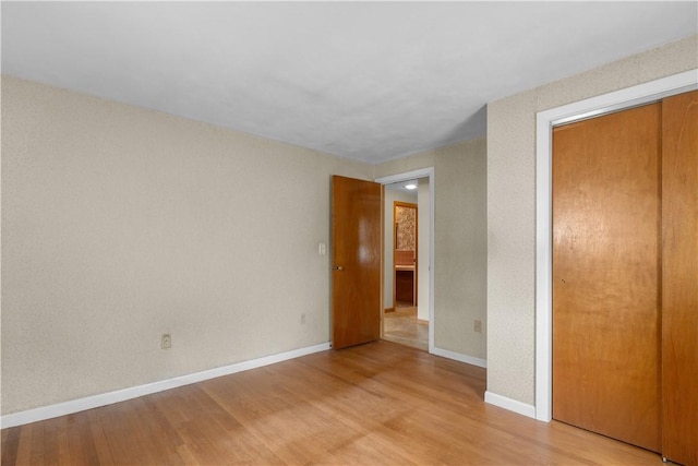352 Cove Ave, Warwick, RI 02886 - unfurnished bedroom with light wood-style floors and a closet