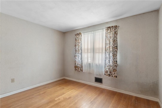 352 Cove Ave, Warwick, RI 02886 - empty room with light wood-style flooring and baseboards