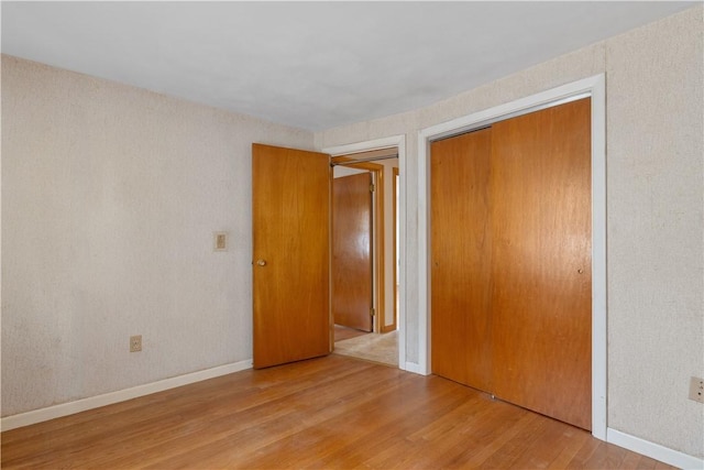 352 Cove Ave, Warwick, RI 02886 - unfurnished bedroom featuring wood finished floors and a closet