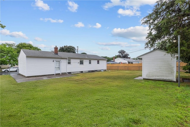 352 Cove Ave, Warwick, RI 02886 - back of property featuring a storage shed and a chimney