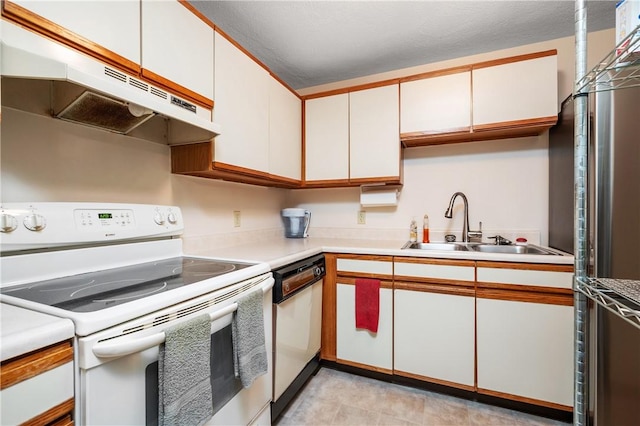 2 Angle St Unit 5, Lincoln, RI 02838 - kitchen with white appliances, under cabinet range hood, light countertops, and white cabinetry