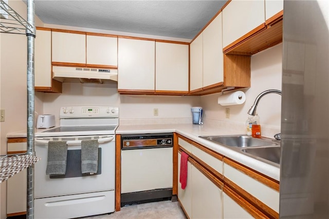 2 Angle St Unit 5, Lincoln, RI 02838 - kitchen featuring white appliances, under cabinet range hood, light countertops, and white cabinetry