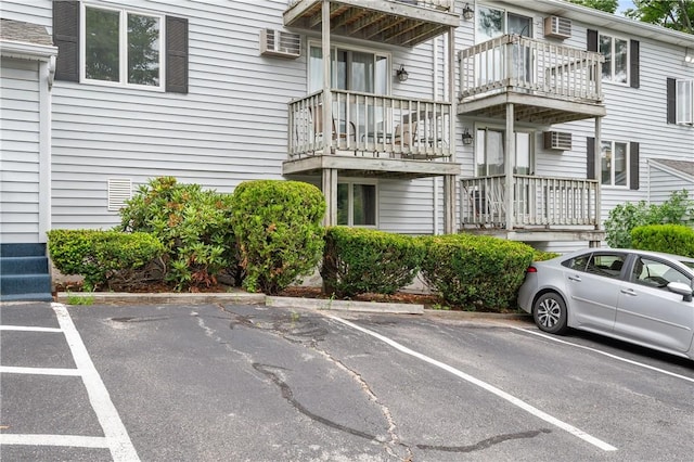 2 Angle St Unit 5, Lincoln, RI 02838 - uncovered parking lot featuring a wall mounted air conditioner and a wall mounted AC