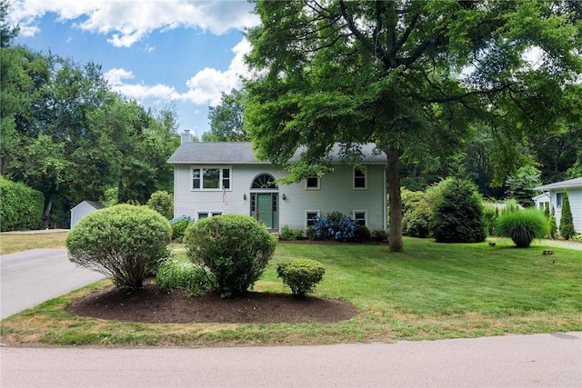 5 Spirketing St, Jamestown, RI 02835 - split foyer home with a chimney and a front yard