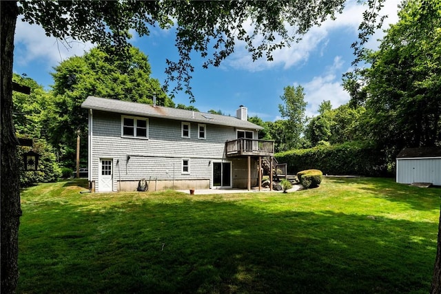 5 Spirketing St, Jamestown, RI 02835 - rear view of property with a chimney, a wooden deck, a shed, a lawn, and a patio