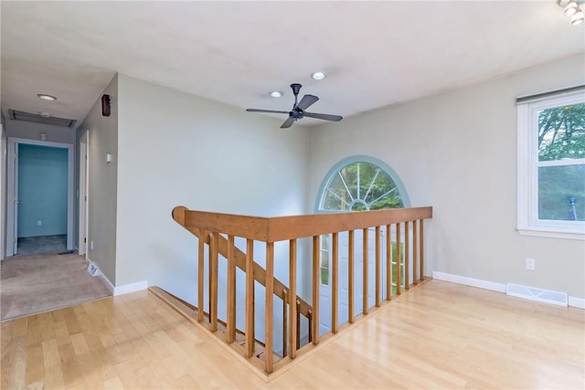 5 Spirketing St, Jamestown, RI 02835 - hall with wood finished floors, healthy amount of natural light, recessed lighting, and an upstairs landing