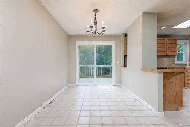 5 Spirketing St, Jamestown, RI 02835 - unfurnished dining area with a chandelier, plenty of natural light, and a skylight
