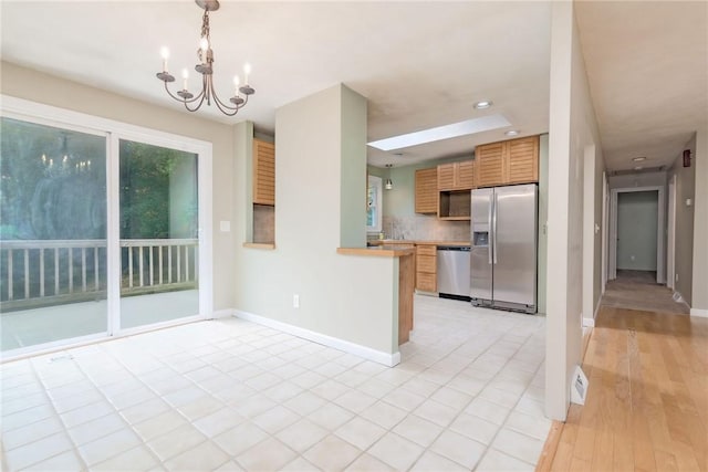 5 Spirketing St, Jamestown, RI 02835 - kitchen featuring stainless steel appliances, a chandelier, light countertops, recessed lighting, and pendant lighting