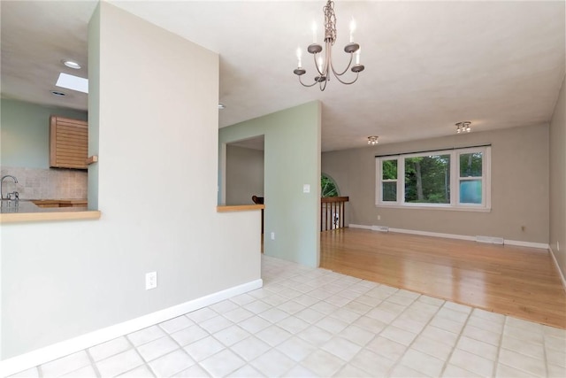 5 Spirketing St, Jamestown, RI 02835 - empty room with wood finished floors, a chandelier, and recessed lighting