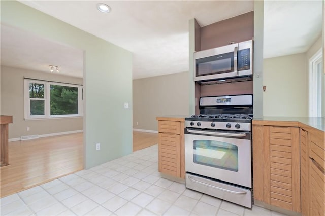 5 Spirketing St, Jamestown, RI 02835 - kitchen featuring appliances with stainless steel finishes, light wood-style flooring, light countertops, recessed lighting, and light brown cabinets