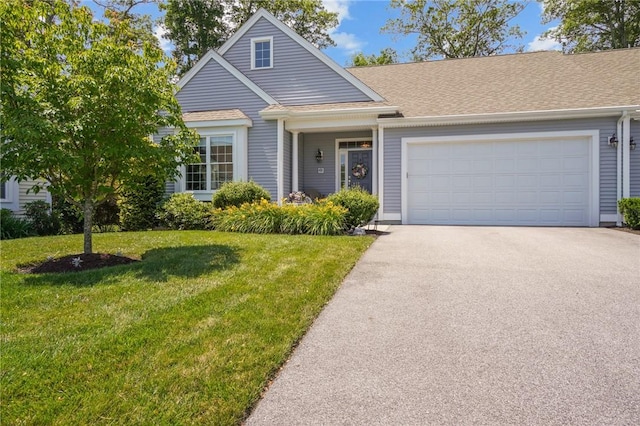 170 Providence Pike Unit 145, North Smithfield, RI 02896 - view of front facade with asphalt driveway, a front lawn, a garage, and roof with shingles