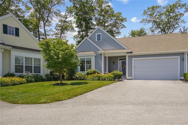 170 Providence Pike Unit 145, North Smithfield, RI 02896 - traditional home featuring driveway, a front lawn, an attached garage, and roof with shingles