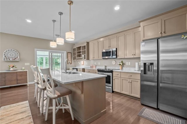 170 Providence Pike Unit 145, North Smithfield, RI 02896 - kitchen with appliances with stainless steel finishes, glass insert cabinets, dark wood finished floors, a kitchen island with sink, and a breakfast bar area