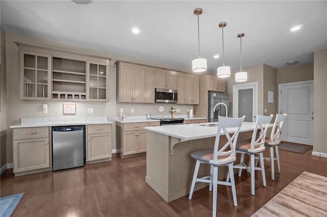 170 Providence Pike Unit 145, North Smithfield, RI 02896 - kitchen with stainless steel appliances, a center island with sink, a breakfast bar area, glass insert cabinets, and recessed lighting