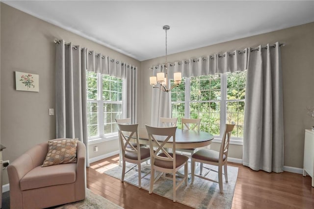 170 Providence Pike Unit 145, North Smithfield, RI 02896 - dining space with a chandelier and wood finished floors