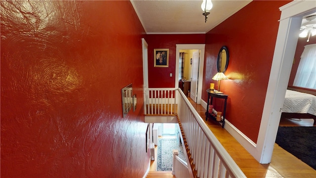 95 Burlington St, Providence, RI 02906 - corridor featuring wood finished floors, ornamental molding, and an upstairs landing