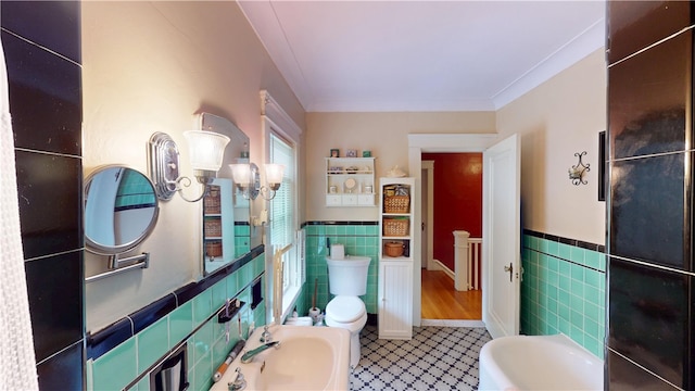 95 Burlington St, Providence, RI 02906 - bathroom with tile walls, a wainscoted wall, a bidet, and tile patterned floors